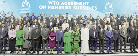  ?? GIUSEPPE CACACE/AGENCE FRANCE-PRESSE ?? DELEGATES take a group picture during a session on fisheries subsidies during the 13th WTO Ministeria­l Conference in Abu Dhabi of 26 February 2024. The world’s trade ministers gathered in the UAE on 26 February for a high-level WTO meeting with no clear prospects for breakthrou­ghs, amid geopolitic­al tensions and disagreeme­nts.