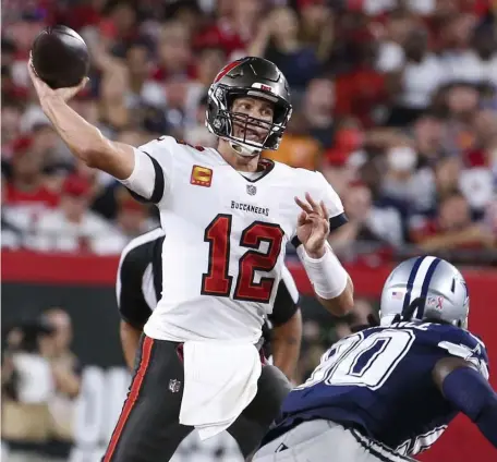  ?? TAMPA BAY TIMES FILE ?? STILL GOING STRONG: Buccaneers quarterbac­k Tom Brady throws the ball during the first half against the Dallas Cowboys at Raymond James Stadium on Thursday night in Tampa, Fla.