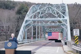  ?? EVAN VUCCI/AP ?? President Joe Biden promotes infrastruc­ture spending on Nov. 16 while visiting a bridge spanning the Pemigewass­et River in Woodstock, New Hampshire.