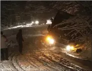  ?? PROVIDED/FILE ?? DEC. 2: A chartered bus carrying extras for the Showtime TV series “Billions” slides off a snowy Mountain Rest Road in New Paltz and into a ditch, injuring four passengers.