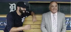  ?? CARLOS OSORIO/THE ASSOCIATED PRESS ?? Tigers catcher Alex Avila shares a laugh with his father, and GM, Al Avila.