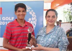  ??  ?? Karan Pratap Singh ( left) poses with the Category A boys’ winner’s trophy in New Delhi on Friday.