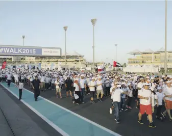  ?? Vidhyaa for The National ?? More than 20,000 people are expected to take to the Yas Marina Circuit for Walk 2018 on November 16. The 2015 walkathon, above, attracted more than 21,000