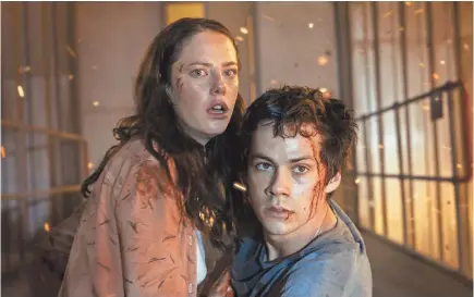  ?? PHOTOS BY 20TH CENTURY FOX ?? Teresa (Kaya Scodelario) and Thomas (Dylan O’Brien) fight to survive in “Maze Runner: The Death Cure.” Shooting on the film was halted after three days when O’Brien was seriously injured on set in 2016.