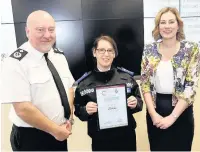  ??  ?? PCSO Lisa Moore receives her award