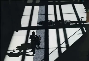  ?? JANE TYSKA — STAFF PHOTOGRAPH­ER ?? Terminal 2 at San Francisco Internatio­nal Airport is practicall­y empty in early April. Air traffic was almost at a standstill due to the coronaviru­s pandemic. Now, with the virus surging again, travel comes with a whole new set of headaches.