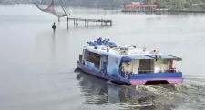  ?? H. VIBHU ?? Touching a milestone: A Water Metro ferry leaves the High Court terminal on Thursday.