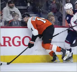  ?? MATT SLOCUM — THE ASSOCIATED PRESS ?? The Flyers’ Sean Couturier, left, battles with Columbus’s Damon Severson during the first period Thursday night.