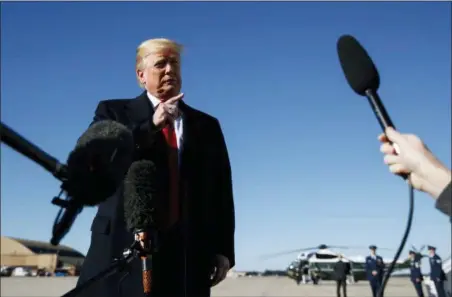  ?? CAROLYN KASTER — THE ASSOCIATED PRESS ?? President Donald Trump talks to reporters as before boarding Air Force One, Thursday in Andrews Air Force Base, Md., en route to campaign stops in Montana, Arizona and Nevada.