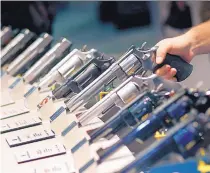  ?? JOHN LOCHER/ASSOCIATED PRESS ?? Handguns are displayed at the Smith & Wesson booth at the Shooting, Hunting and Outdoor Trade Show in Las Vegas, Nev., in January 2016.