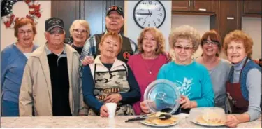  ?? JESI YOST — DIGITAL FIRST MEDIA ?? Woman’s Club of Oley joined Oley Valley American Legion Post 878 to volunteer at Veterans Making A Difference. Pictured left to right: Cindy Hoffman, Charles Miller, Eleanor Shaner, Erma Miller, Bill Lutz, Donna Wetzel, Gladys Turner, Kristen Lang, and...