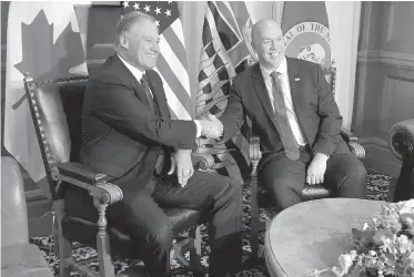  ??  ?? Washington State Gov. Jay Inslee, left, shakes hands with Premier John Horgan as Inslee visits the B.C. legislatur­e Tuesday. The governor got warm applause from MLAs when he spoke of his government’s challenges to President Donald Trump’s “illegal and...