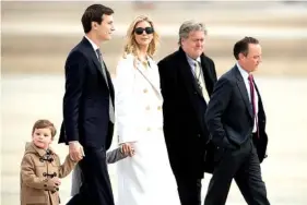  ?? THE ASSOCIATED PRESS ?? Ivanka Trump, third from left,daughter of President Donald Trump, her husband, senior adviser Jared Kushner, second from left,their two children Arabella Kushner and Joseph Kushner, Chief White House Strategist Steve Bannon, second from right, and...