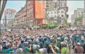  ?? AFP ?? BANGLADESH: Police stop protesters as they march towards the Indian embassy in Dhaka on Thursday, to protest against the remarks on the Prophet Mohammed by BJP’s Nupur Sharma.