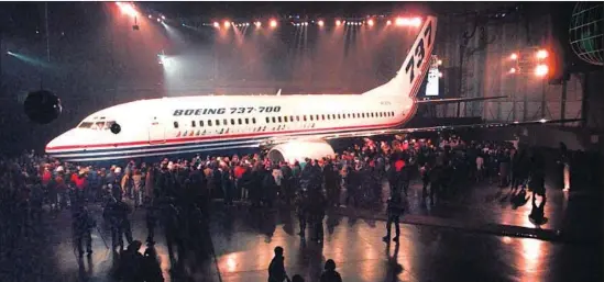  ?? Robert Sorbo Associated Press ?? BOEING’S crisis comes after 50 years of remarkable success in making the 737 a profitable workhorse. Above, the rollout of the first 737-700 in 1996 in Renton, Wash.