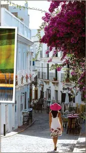  ??  ?? ENCHANTING: The elegant streets of Tarifa. Inset above: Weaving scarves in Tangier