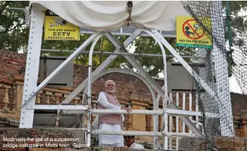 ?? Modi visits the site of a suspension bridge collapse in Morbi town, Gujarat ??