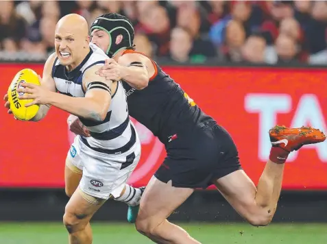  ?? Picture: MICHAEL KLEIN ?? GIVING IT HIS ALL: Geelong’s Gary Ablett stands up in the tackle of Melbourne’s Angus Brayshaw last night.