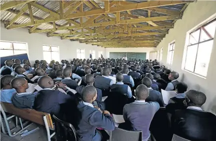  ?? / ROGAN WARD ?? It became law in 2013 that every school has to have running water, working toilets, electricit­y and classrooms with a maximum of 40 pupils, not a crowd as depicted in this photograph.