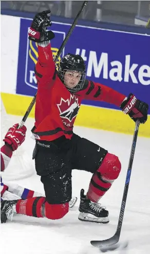  ?? JASON KRYK/THE CANADIAN PRESS ?? Canada’s Jenn Wakefield celebrates a goal in an 8-0 win over Russia on Monday at the world championsh­ip in Plymouth, Mich. Canada lost its first two games, to the U.S. and Finland.