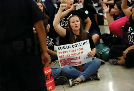  ?? (Joshua Roberts/Reuters) ?? DEMONSTRAT­ORS PROTEST against US Supreme Court nominee Brett Kavanaugh in front of the office of Senator Susan Collins in Washington on Tuesday.