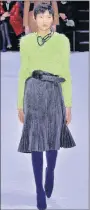  ?? GETTY ?? Balenciaga’s shaggy, neongreen top and pleated skirt.