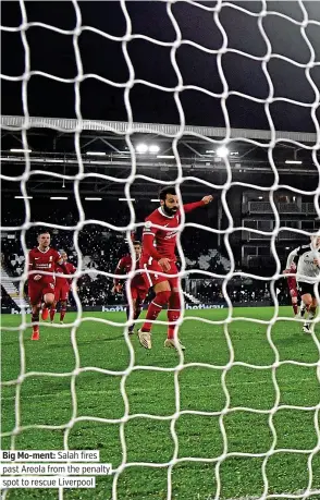  ??  ?? Big Mo-ment: Salah fires past Areola from the penalty spot to rescue Liverpool