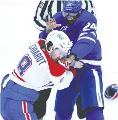  ?? CLAUS ANDERSEN / GETTY IMAGES ?? Ben Chiarot of the Montreal Canadiens mixes it up
with Wayne Simmonds of the Leafs.