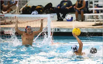  ?? RECORDER PHOTOS BY BRIAN WILLIAMS ?? Strathmore High School boys water polo goalie Tyler Maita rises up out of the water to try and block the shot of Sierra Pacific's Ryan Simmons in the first half of Monday's game at Strathmore. The Spartans lost 17-10.