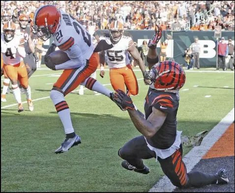  ?? Tribune News Service ?? Denzel Ward of Cleveland intercepts a pass intended for Ja’Marr Chase during Sunday’s game. The Bengals have a bye this week following the loss to the Browns.