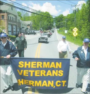  ?? Hearst Connecticu­t Media file photo ?? Proud veterans march together in Sherman’s 2014 Memorial Day parade.