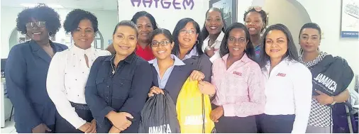  ?? CONTRIBUTE­D ?? Members of the Haygem Tours and Travel Service Ltd team pose with their Jamaica-branded bags with members of the Jamaica Tourist Board’s sales and marketing team on their recent visit to Trinidad and Tobago. The merchandis­e were given to visited agencies and contained product updates and Jamaican memorabili­a.