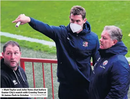  ?? Tom Sandberg/PPAUK ?? Matt Taylor and John Yems chat before Exeter City’s match with Crawley Town at St James Park in October