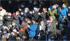  ??  ?? TOO CLOSE FOR COMFORT: Reading fans watch their side beat Forest