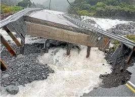  ??  ?? Above: Heavy rain has caused slips and damaged parts of State Highway 73 between Arthur’s Pass and the West Coast. The western approach of Goat Creek Bridge has been washed away.