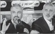  ?? MOHAMMED SABER/ THE ASSOCIATED PRESS ?? The exiled Hamas chief Khaled Mashaal, left, met with Prime Minister Ismail Haniyeh during a visit to Gaza on Friday.