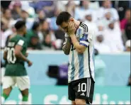  ?? NATACHA PISARENKO — THE ASSOCIATED PRESS ?? Argentina’s Lionel Messi reacts disappoint­ed during the World Cup group C soccer match between Argentina and Saudi Arabia at the Lusail Stadium in Lusail, Qatar on Tuesday.