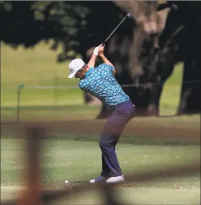  ?? Ronald Martinez / Getty Images ?? Justin Rose plays a shot on the 17th hole during the third round of the Charles Schwab Challenge on Saturday at Colonial Country Club in Fort Worth, Texas.