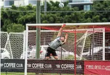  ?? Photos: DSL Photograph­y ?? South West Queensland Thunder keeper Jacob Sayle touches the ball over the crossbar during his side’s game against Olympic FC.