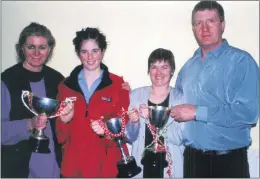  ??  ?? Mary O’Regan (left), with Arlen O’Callaghan and her parents Maura and Gerard at the victory social held by St Bartholome­w’s Ladies Football Club in Kades Kounty, Glenville in early 2000.