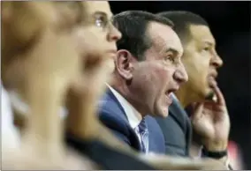  ?? MICHAEL DWYER — THE ASSOCIATED PRESS FILE ?? File- This file photo shows Duke head coach Mike Krzyzewski yelling instructio­ns from the bench during the first half of an NCAA college basketball game against Boston College in Boston. Krzyzewski isn’t interested in thinking about how his latest...