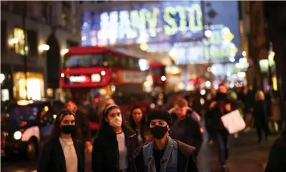  ?? Photograph: Henry Nicholls/Reuters ?? Shoppers on Oxford Street in London as the capital prepares to enter tier 3 of England’s coronaviru­s restrictio­ns