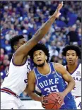  ?? RICH SUGG/ TRIBUNE NEWS SERVICE ?? Duke big man Marvin Bagley drives past Kansas' Silvio De Sousa (left) during the NCAA Midwest Region Final on March 25 in Omaha, Neb.