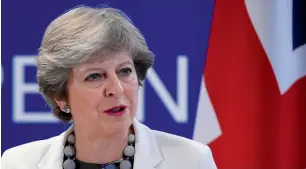  ?? — AFP ?? Theresa May speaks to the Press at the end of a two-day EU leaders summit in Brussels.