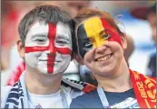  ??  ?? FANS OF ENGLAND AND BELGIUM pose before the Russia 2018 World Cup Group G football match between the two countries at the Kaliningra­d Stadium.