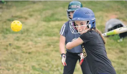  ?? JASON MALLOY/THE GUARDIAN ?? Faith Turner keeps her eye on the wiffle ball during West Royal under-12 girls' softball practice Monday in Charlottet­own.