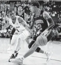  ?? Michael Wyke / Associated Press ?? Auburn guard Bryce Brown, right, scored 18 consecutiv­e points and after the game questioned Texas A&amp;M’s effort.