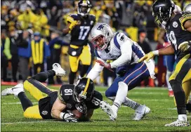  ?? GETTY IMAGES FILE ?? The competitio­n committee’s proposal seeks to take the guesswork out of plays such as Steelers TE Jesse James’ overturned touchdown against the Patriots.