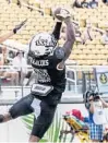  ?? WILLIE J. ALLEN JR./ORLANDO SENTINEL ?? UCF defensive back Jaiden Francois intercepts the ball on wide receiver Stephen Martin during the spring football game last weekend.