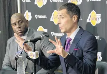  ?? Nick Ut Associated Press ?? WITH MAGIC JOHNSON, left, and Rob Pelinka running the Lakers’ basketball operations, there apparently was no room for Jerry West, who says Lakers fans “have to just put it to rest. Enough is enough, OK?”